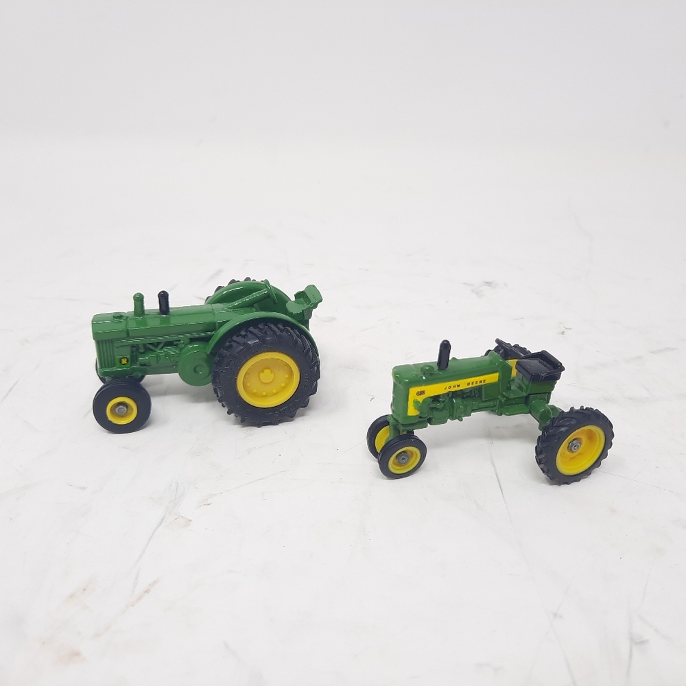 FINAL PRICE!! Two 1/64 john deere toy tractors